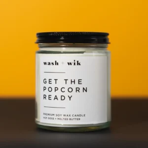 A candle that says get the popcorn ready