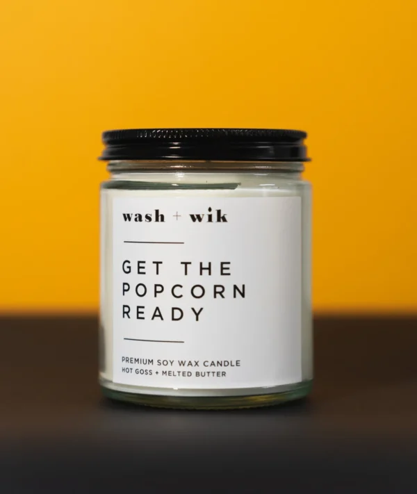 A candle that says get the popcorn ready