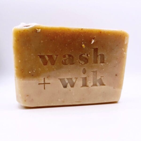 A bar of soap with the words " wash and wik ".