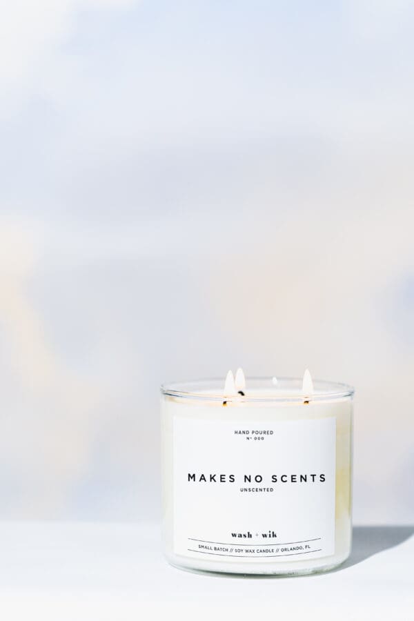 A candle that says " makes no scents ".