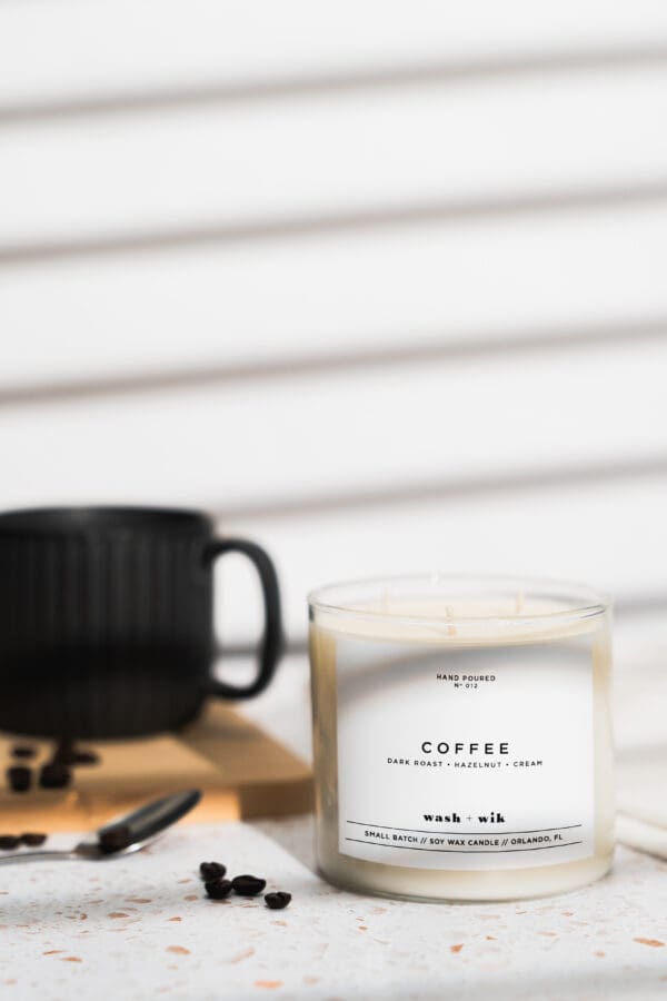 A candle sitting on top of a wooden table.