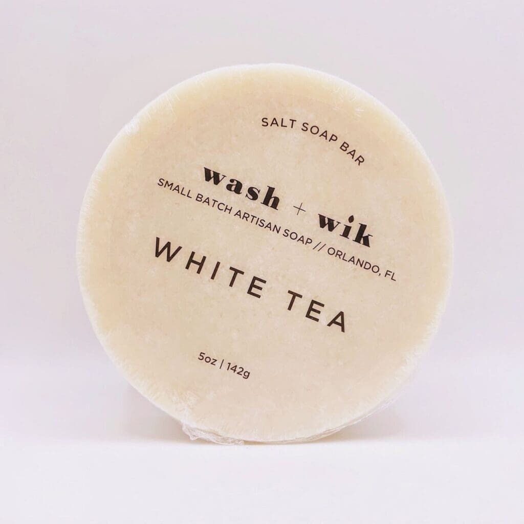 A white soap bar sitting on top of a counter.