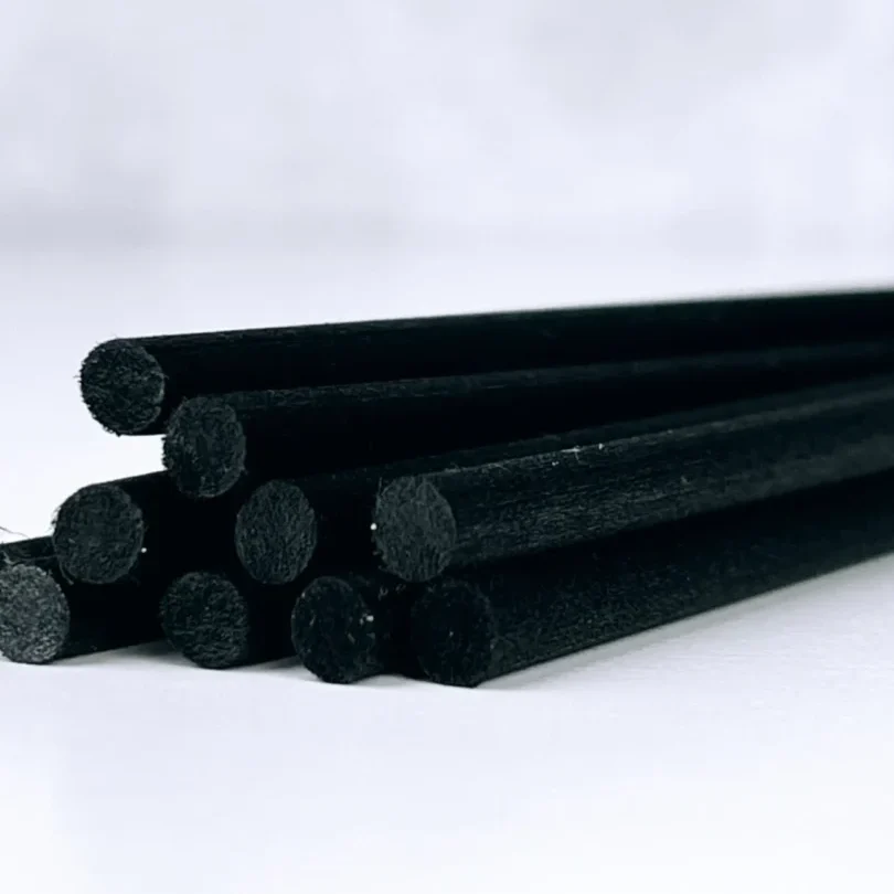 A bunch of black rods are stacked on top of each other